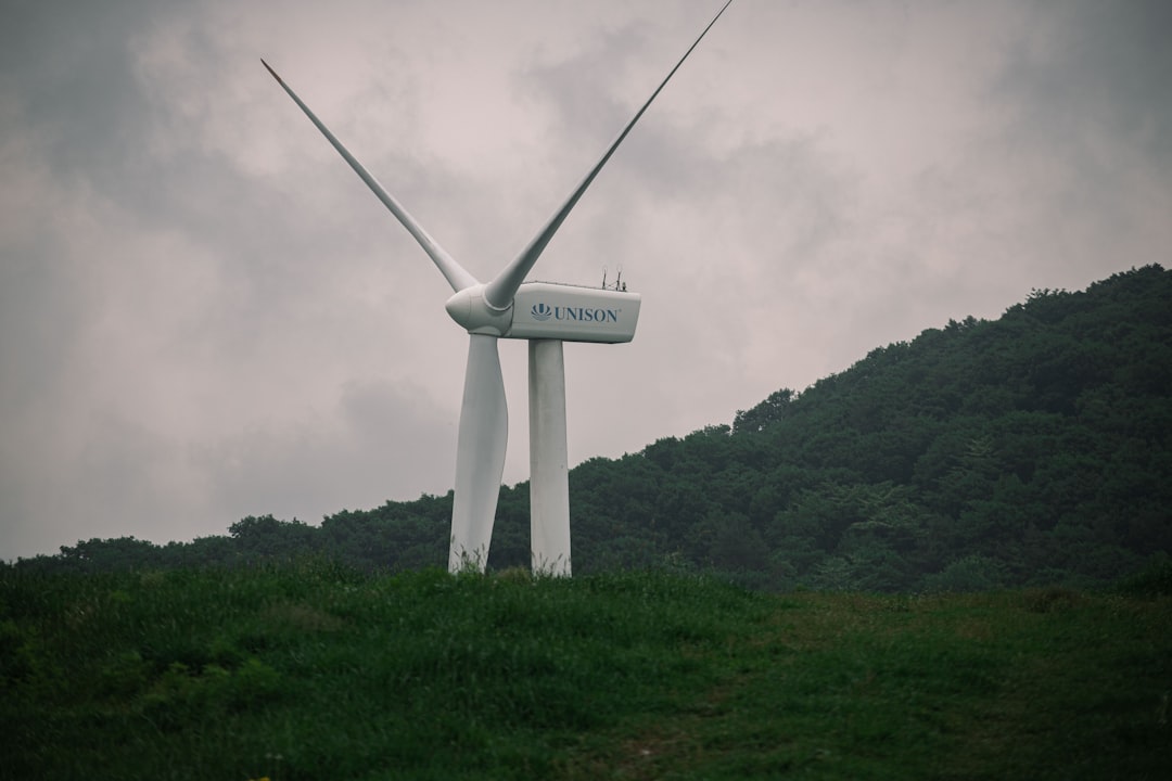 Modern wind turbine against blue sky